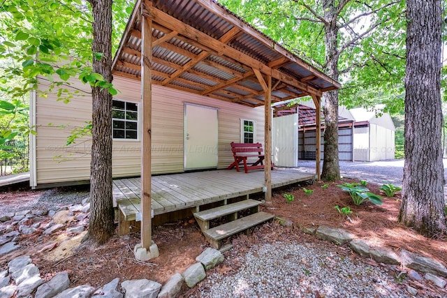 wooden terrace with an outdoor structure