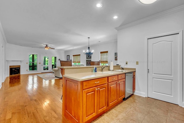 kitchen featuring crown molding, stainless steel dishwasher, a sink, light countertops, and recessed lighting