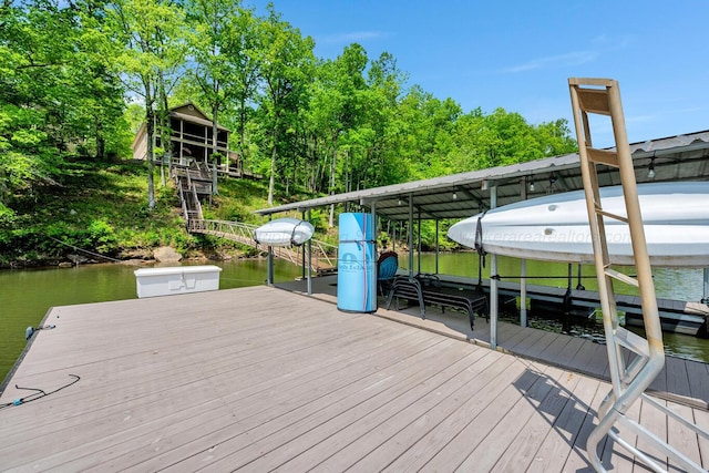 view of dock featuring boat lift and a water view