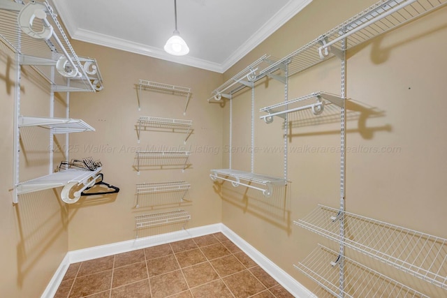 spacious closet with tile patterned floors