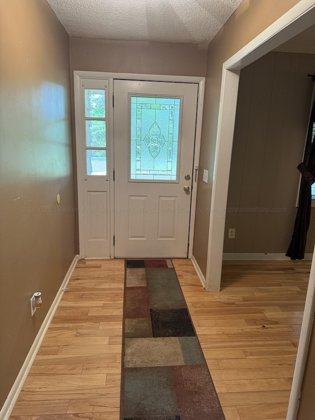 4407 Pineywoods Sipsey Rd, Jasper, AL 35504 - entryway featuring light wood-style flooring, baseboards, and a textured ceiling
