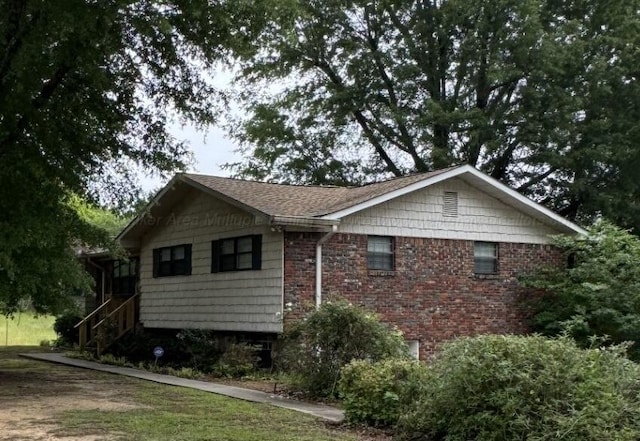 4407 Pineywoods Sipsey Rd, Jasper, AL 35504 - view of side of home featuring stairway
