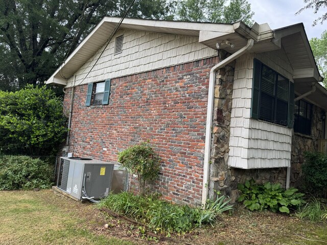 4407 Pineywoods Sipsey Rd, Jasper, AL 35504 - view of home's exterior featuring stone siding, central air condition unit, and brick siding