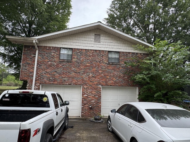 4407 Pineywoods Sipsey Rd, Jasper, AL 35504 - view of home's exterior with a garage, driveway, and brick siding