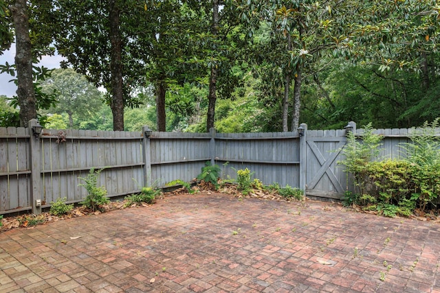 1004 Quarry Rd, Jasper, AL 35501 - fenced backyard with a patio area and a gate