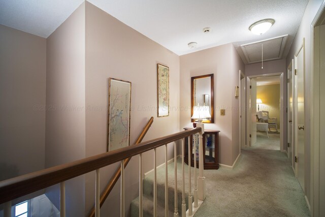 1004 Quarry Rd, Jasper, AL 35501 - hall featuring attic access, an upstairs landing, and light carpet