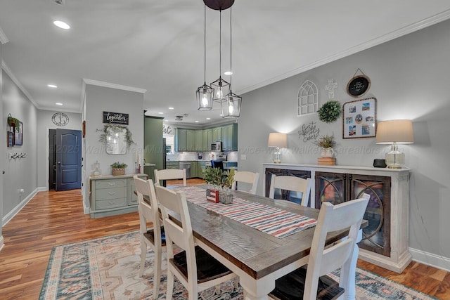 539 Hayfield Dr, Dora, AL 35062 - dining area with light wood finished floors, crown molding, and recessed lighting