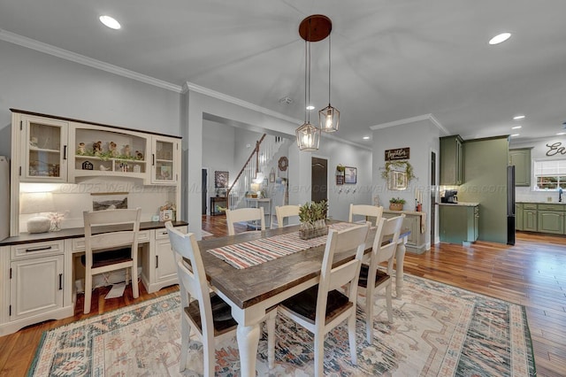 539 Hayfield Dr, Dora, AL 35062 - dining area with ornamental molding, light wood-style floors, recessed lighting, and stairway