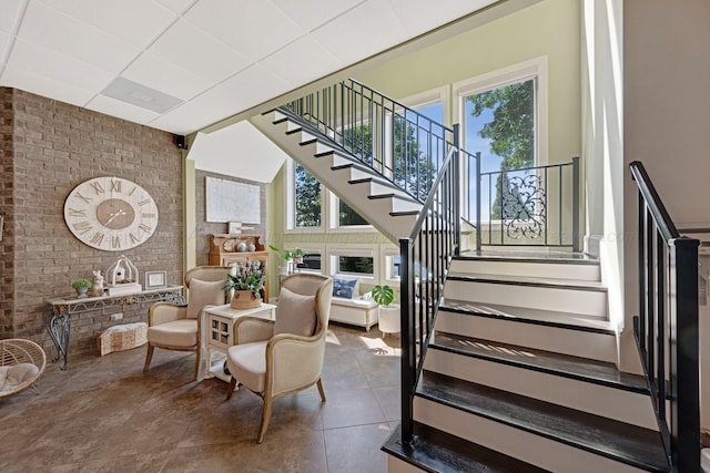 154 County Rd 389, Cullman, AL 35057 - stairway featuring healthy amount of natural light, brick wall, and tile patterned floors