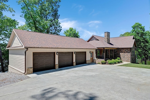 154 County Rd 389, Cullman, AL 35057 - view of front of property featuring a chimney, roof with shingles, driveway, and a garage