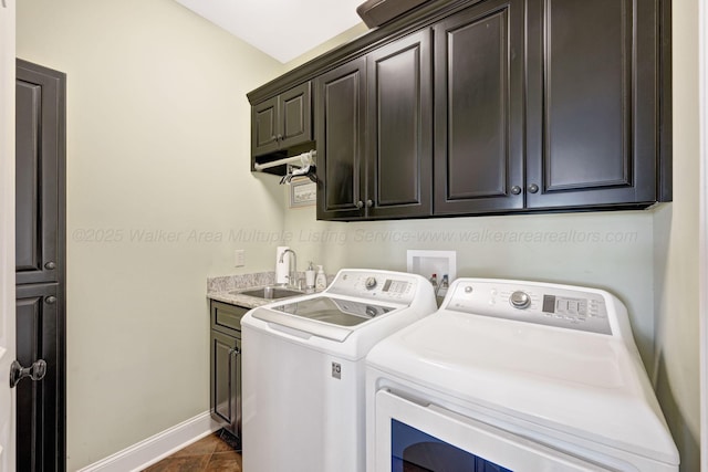 154 County Rd 389, Cullman, AL 35057 - laundry area with cabinet space, washer and clothes dryer, and baseboards