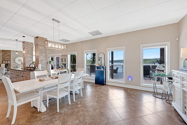 154 County Rd 389, Cullman, AL 35057 - dining room with tile patterned flooring, baseboards, and a drop ceiling