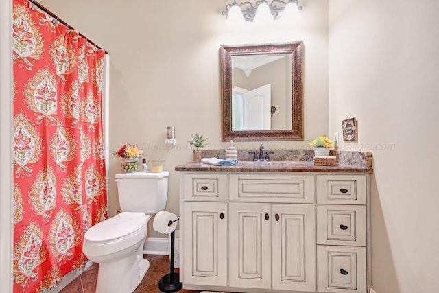 154 County Rd 389, Cullman, AL 35057 - bathroom with toilet, vanity, tile patterned floors, baseboards, and a shower with curtain