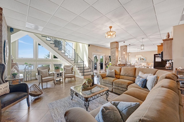 154 County Rd 389, Cullman, AL 35057 - living area featuring stairway, baseboards, a drop ceiling, and light tile patterned floors