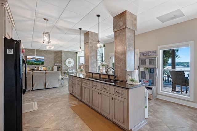 154 County Rd 389, Cullman, AL 35057 - kitchen featuring freestanding refrigerator, a sink, open floor plan, and light tile patterned floors