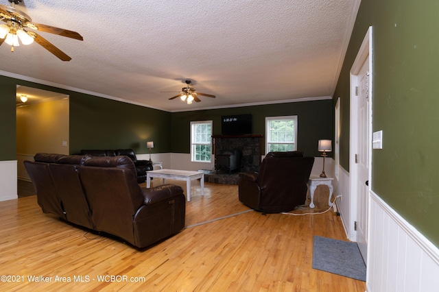 12 Dover Rd, Haleyville, AL 35565 - living area with ceiling fan, a textured ceiling, crown molding, and light wood finished floors