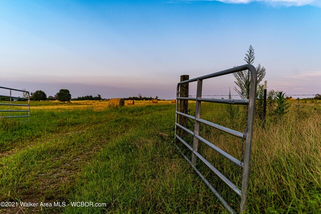 12 Dover Rd, Haleyville, AL 35565 - gate at dusk with a rural view and fence