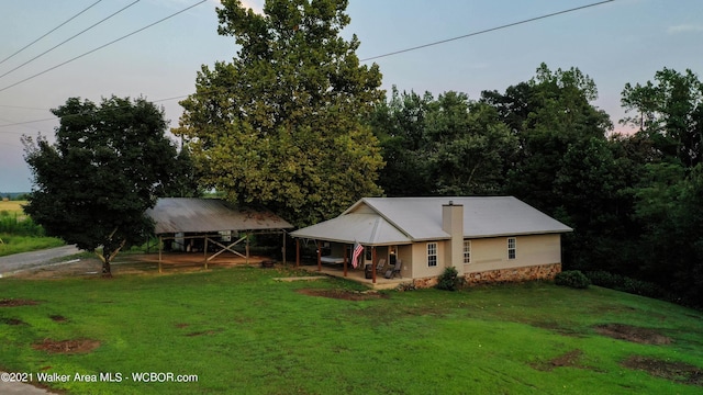 12 Dover Rd, Haleyville, AL 35565 - view of front of home with a front yard, covered porch, and a carport