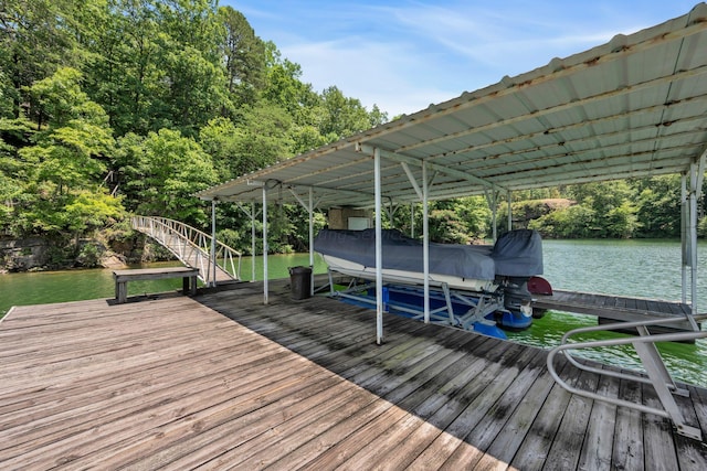 view of dock featuring a water view and boat lift