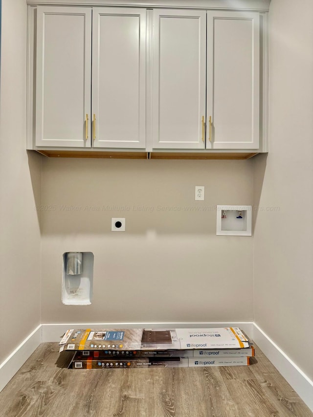 laundry room with washer hookup, cabinet space, baseboards, and hookup for an electric dryer