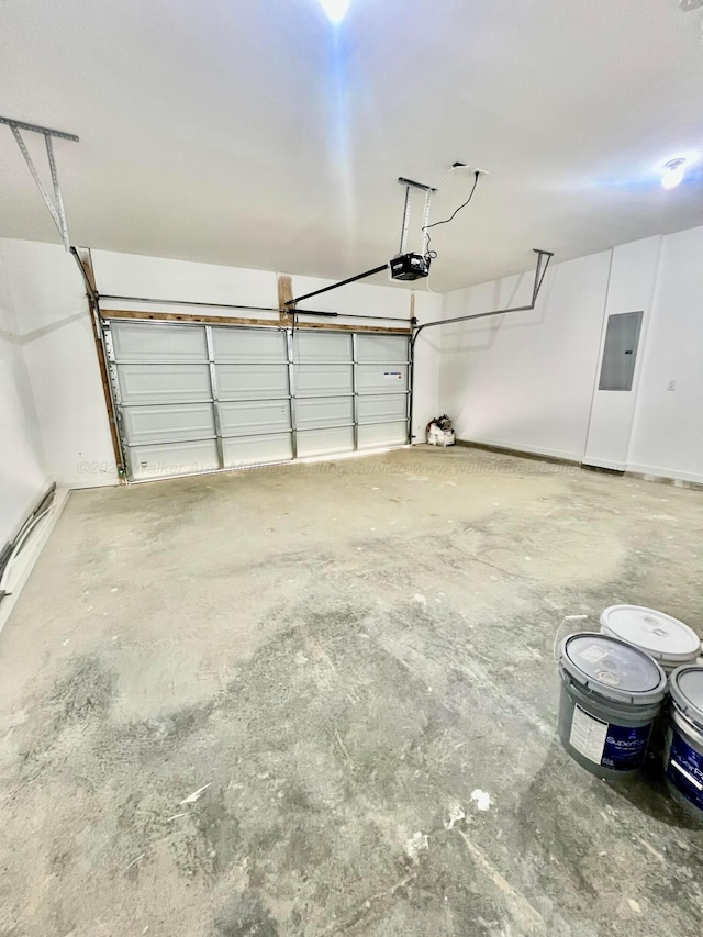 garage with electric panel and a garage door opener