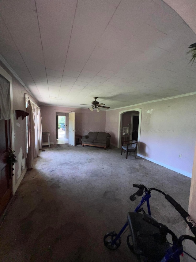 2514 15th Ave, Haleyville, AL 35565 - unfurnished living room featuring arched walkways and carpet floors