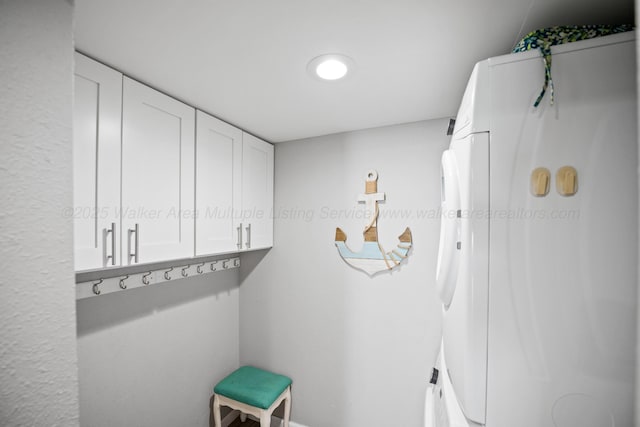 mudroom featuring washer / dryer and baseboards