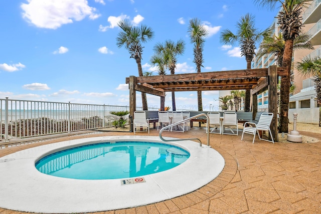 view of swimming pool featuring a pergola, a fenced backyard, a patio, a water view, and a pool