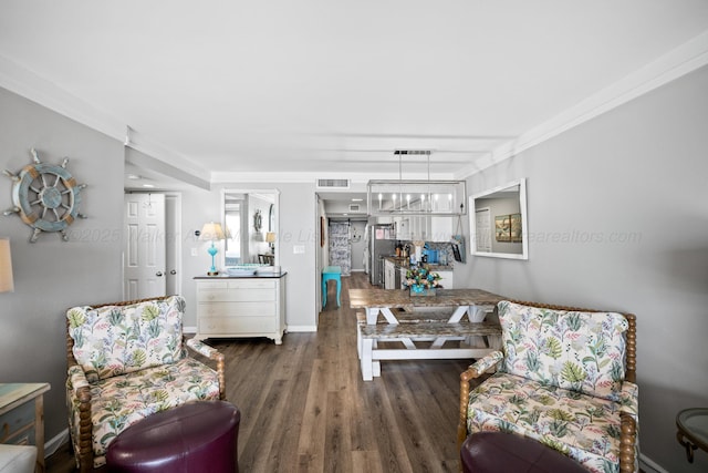 living room with wood finished floors and baseboards