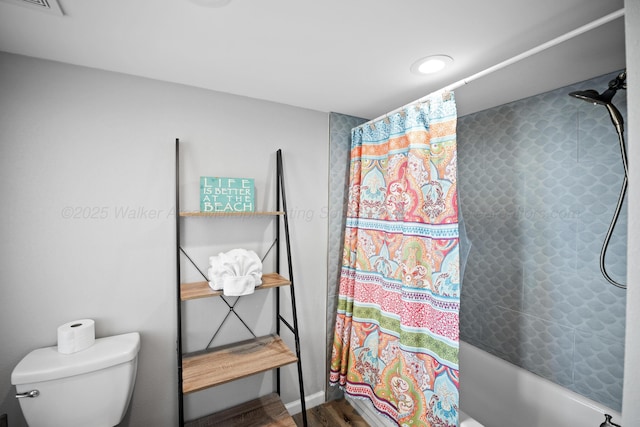 full bathroom with shower / bath combo, toilet, and wood finished floors