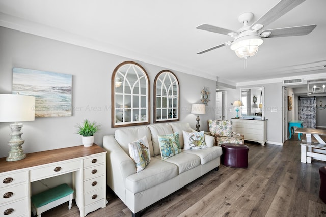 living room featuring a ceiling fan, wood finished floors, and ornamental molding