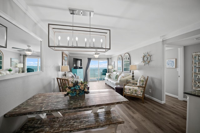 dining space with wood finished floors, baseboards, ceiling fan, and ornamental molding