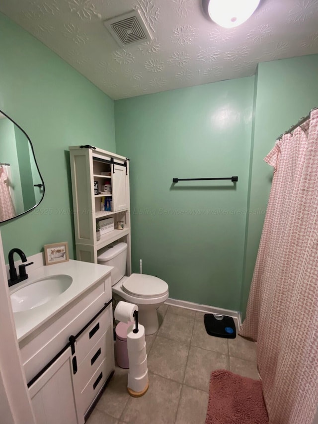 164 County Road 1636, Cullman, AL 35058 - bathroom with vanity, tile patterned flooring, a shower with curtain, and a textured ceiling