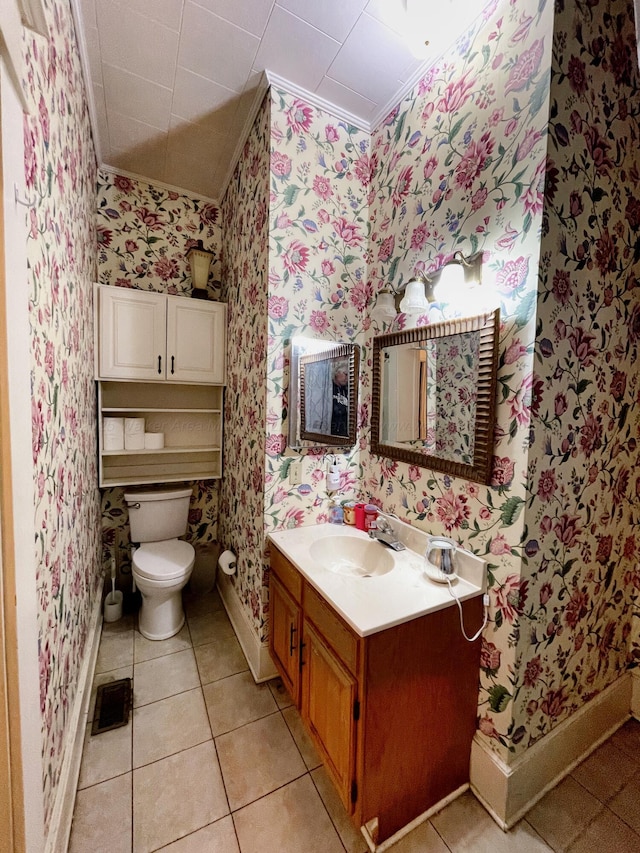 bathroom featuring visible vents, crown molding, wallpapered walls, toilet, and vanity