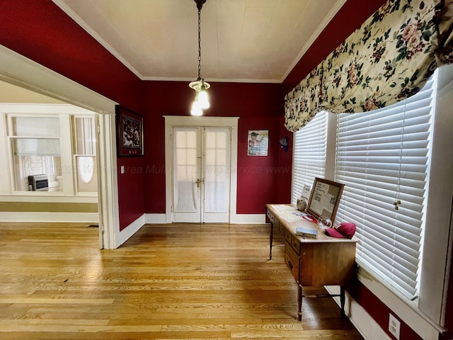 foyer entrance with french doors, crown molding, light wood-style floors, and baseboards