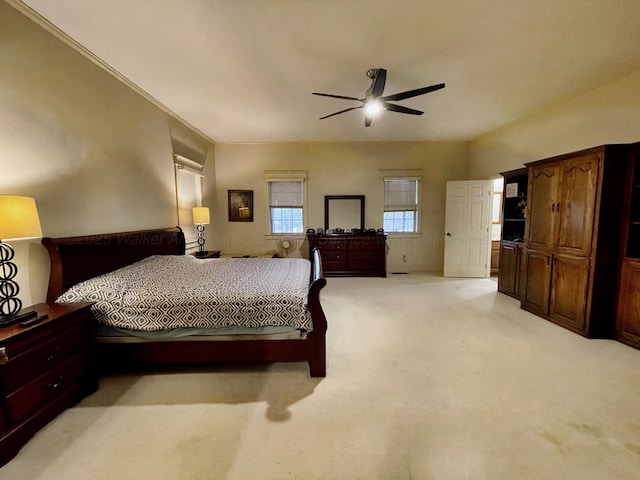 bedroom featuring ceiling fan and light colored carpet