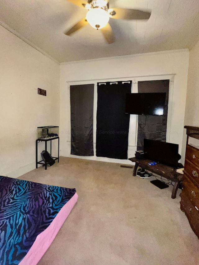 carpeted bedroom with a ceiling fan
