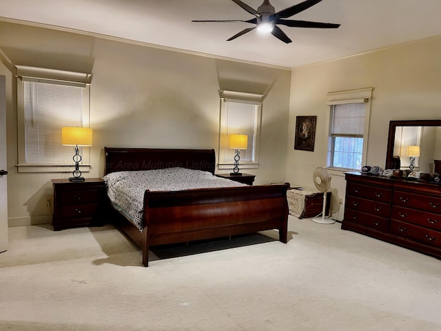 bedroom featuring a ceiling fan and carpet