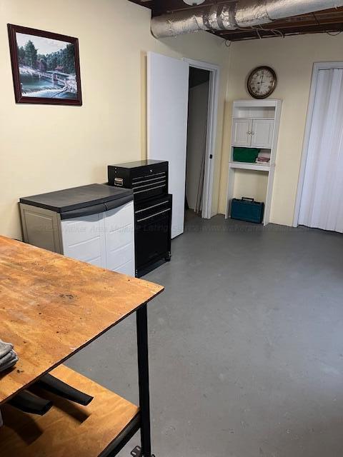 915 County Highway 4, Winfield, AL 35594 - interior space featuring white cabinets and finished concrete flooring