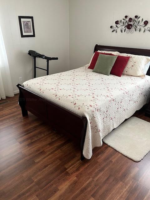 915 County Highway 4, Winfield, AL 35594 - bedroom featuring dark wood finished floors