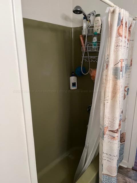 915 County Highway 4, Winfield, AL 35594 - bathroom featuring curtained shower