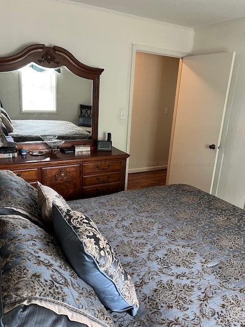 915 County Highway 4, Winfield, AL 35594 - bedroom with wood finished floors and crown molding