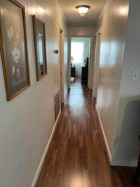 915 County Highway 4, Winfield, AL 35594 - hall featuring visible vents, baseboards, dark wood-style floors, and ornamental molding
