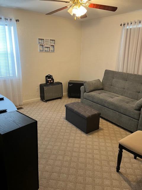 915 County Highway 4, Winfield, AL 35594 - carpeted living room with baseboards and ceiling fan