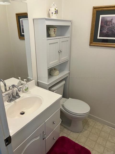 915 County Highway 4, Winfield, AL 35594 - bathroom with baseboards, vanity, and toilet