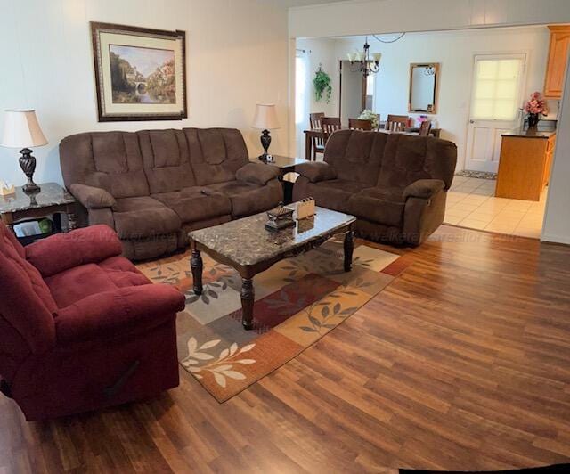915 County Highway 4, Winfield, AL 35594 - living room with a chandelier and light wood-type flooring