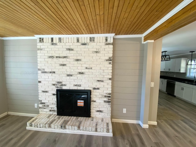 interior details featuring crown molding, a sink, wood ceiling, dishwasher, and a fireplace