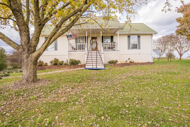 bungalow-style house with covered porch and a front lawn