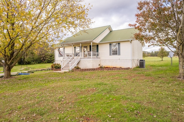 view of front facade with a porch, a front yard, and cooling unit