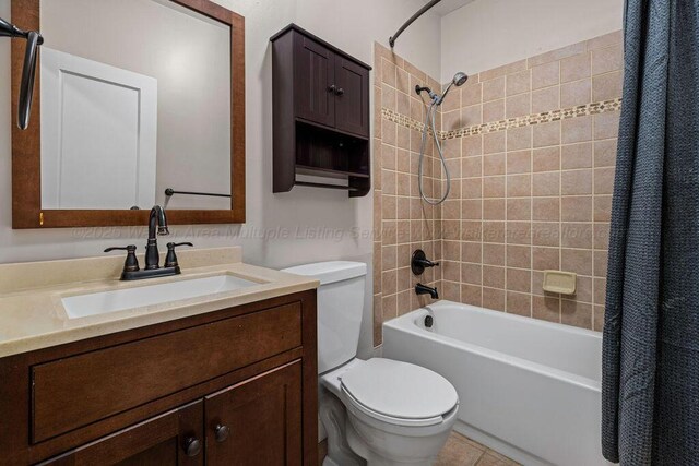 full bathroom with vanity, toilet, and shower / bath combo